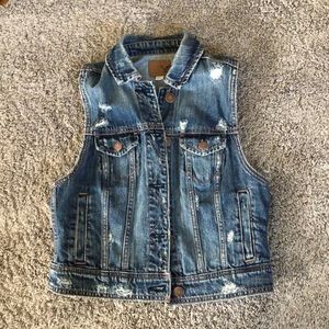 Distressed denim vest